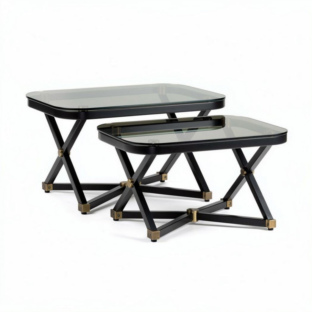 Glass top nesting tables set with black metal base and gold accents